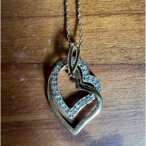 Gold and diamond hearts on 20 inch gold chain necklace.